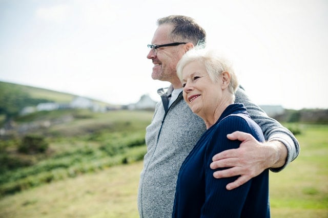 Elderly couple smiling and enjoying quality time together after successfully planning their estate.